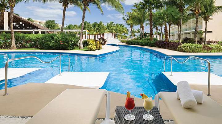 Relaxation by the pool with drinks at azul beach riviera cancun